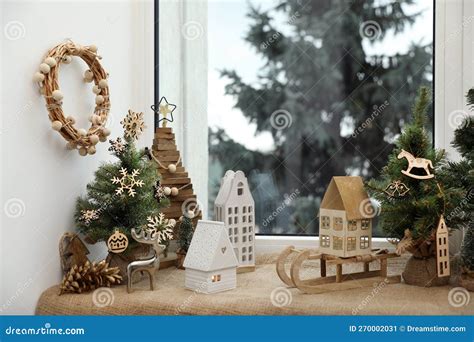 Many Beautiful Christmas Decorations and Small Fir Trees on Window Sill ...