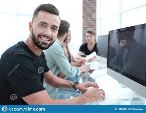 Office Workers Gather Around A Table To Do Research And Implement New