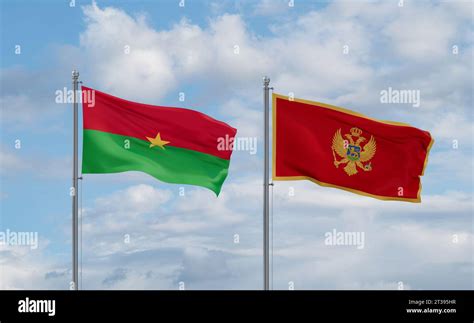 Montenegro And Burkina Faso Flags Waving Together In The Wind On Blue