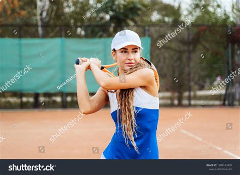 Professional Equipped Female Tennis Player Beating Stock Photo