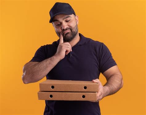 Free Photo Thinking Middle Aged Delivery Man In Uniform And Cap