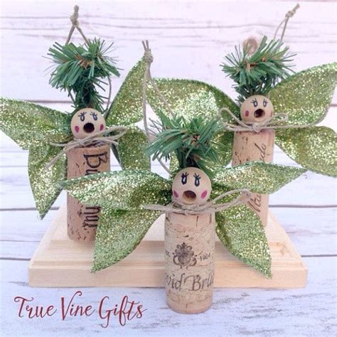 A Set Of Three Wine Cork Angel Ornaments To Decorate For Christmas With