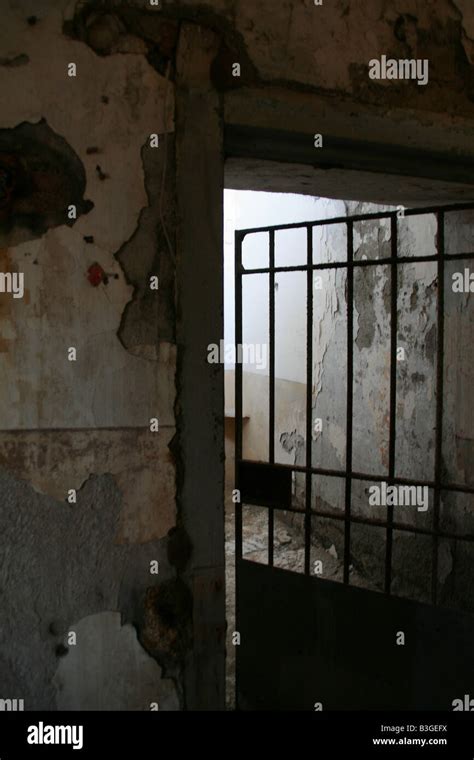 One Old Derelict Prison Cell With Metal Bar Door Stock Photo Alamy