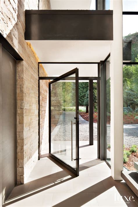 Contemporary Neutral Entry With Steel And Glass Pivot Door Luxe