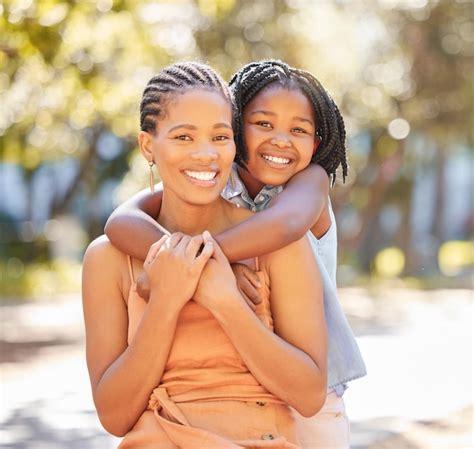 Premium Photo Hug Mother And Daughter Portrait In Park Relaxing