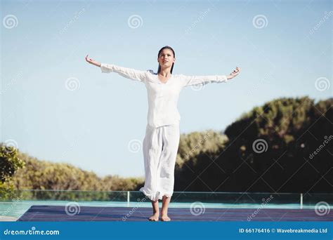 Calm Brunette Doing Yoga Stock Photo Image Of Pool Outdoors