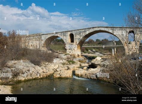 The Pont Julien Is A Roman Stone Arch Bridge Over The Calavon River In