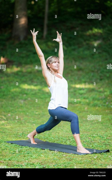 Yoga warrior one pose Stock Photo - Alamy