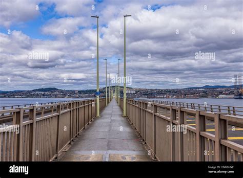 Looking down the pedestrian and cycle walkway on the Tay Road Bridge across the River Tay from ...