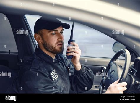 Male Police Officer Driving Car Stock Photo Alamy