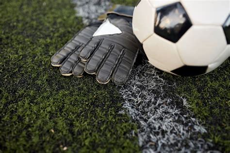 Soccer Ball And Goalkeeper Gloves On Field Stock Photo Image Of Play