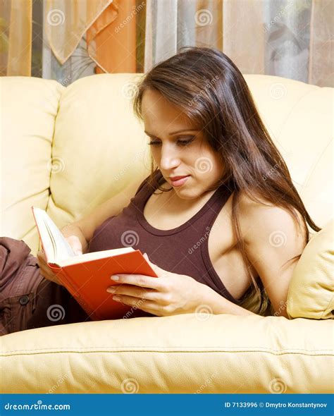 Woman Lying On The Sofa And Reading The Book Stock Photo Image Of