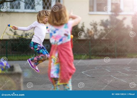 Children Skipping Outdoors Stock Photo Image Of Sisters 140615824