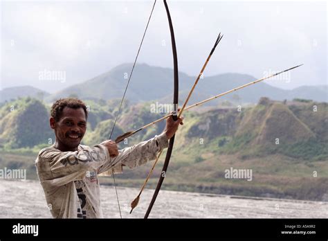 Aeta Man Draws Back The String Of His Bow Near Mount Pinatubo Crater Lake Volcano Luzon