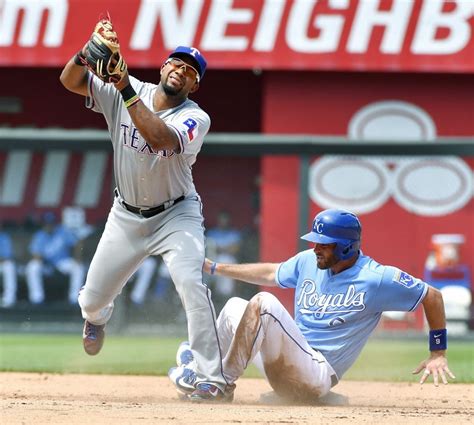 Texas Rangers shortstop Elvis Andrus forces out Kansas City Royals' Drew Butera at second on a ...