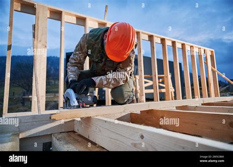 Carpenter Using Circular Saw For Cutting Wooden Plank Man Worker