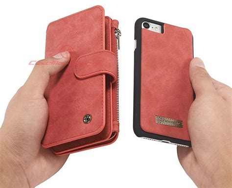 Two Hands Are Holding An Iphone Case With Zippers On The Sides And One