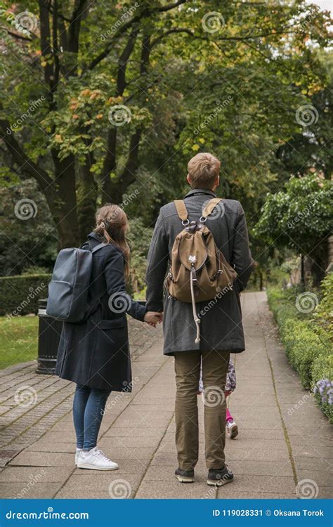 Young Couple Walking with Backpacks Holding Hands Together Editorial Photo - Image of together ...