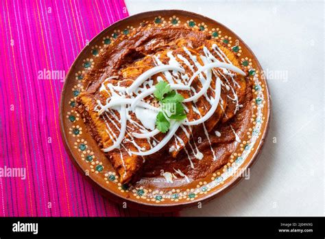 Traditional Mexican Red Enchiladas Stock Photo Alamy