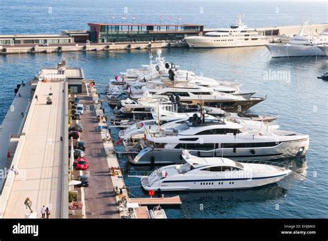 MONTE CARLO, MONACO - OCTOBER 3, 2014: Luxury yachts docked at pier of ...