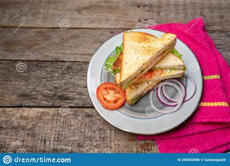 Grilled Cheese Sandwich With Tomato And Whole Grain Bread On Wooden