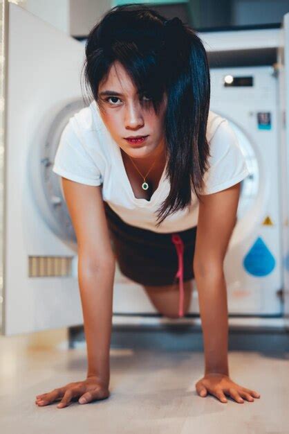 Premium Photo Woman Coming Out From Washing Machine At Home