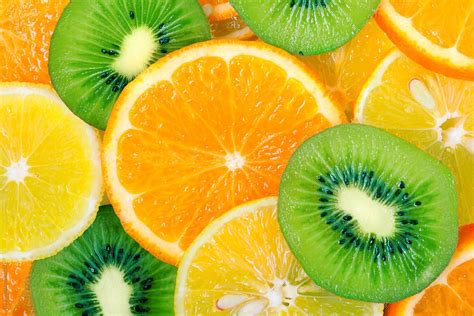 Fruit Slices Background Lemon Kiwi Orange Tangerine By Stocksy