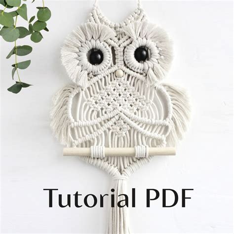 An Owl Wall Hanging Made Out Of Macrame Yarn And Tassels With Text Overlay