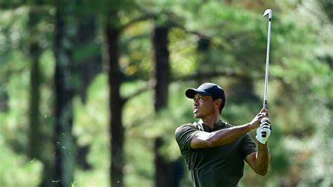 Masters Champion Tiger Woods Plays A Stroke On The No 14 Hole During