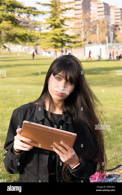 Green Eyed Latina Teen Girl Playing With The Table In The Park Stock Photo Alamy