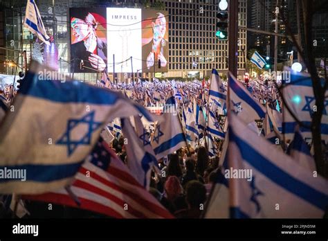 Protestors Crowd Waves The Israeli And Usa Flag During A Demonstration Against The Against