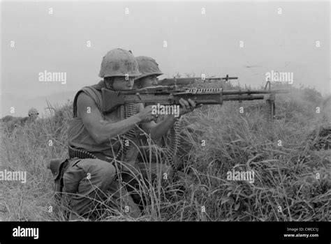 Vietnam War US Marine Machine Gunner And Rifleman Fire At The Enemy