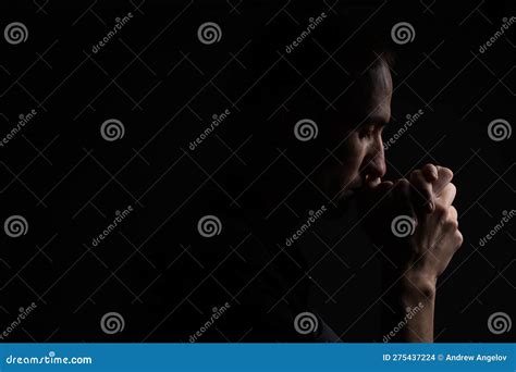 Close Up Of Faithful Mature Man Praying Hands Folded In Worship To God