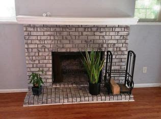 Cozy Living Room with Brick Fireplace