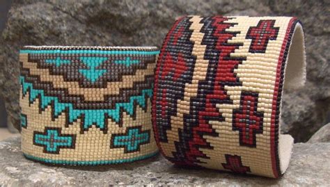 Two Woven Bracelets Sitting Next To Each Other On Top Of A Rocky