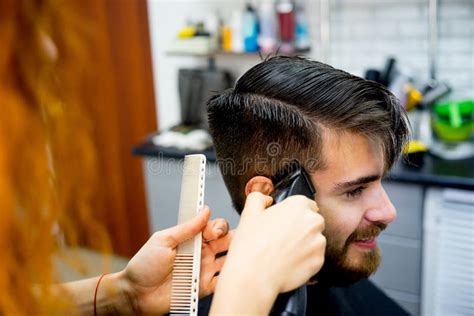 Barber cutting hair stock photo. Image of fashion, haircut - 99136570