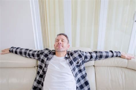 Premium Photo Handsome Man Relaxing On The Couch