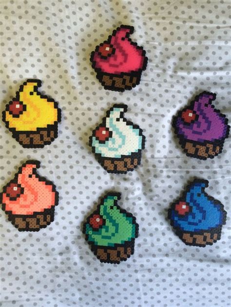 Six Pixelated Cupcakes Are Displayed On A Sheet