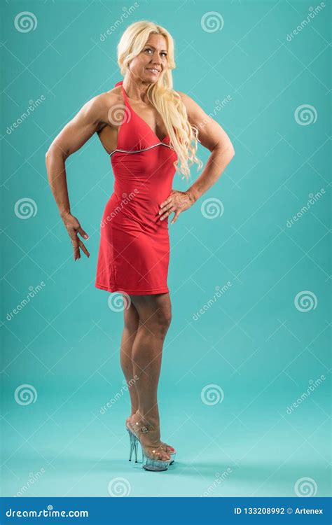 Athletic Woman In Red Dress Posing In Studio Attractive Fitness Lady