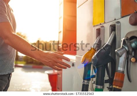 Colorful Petrol Pump Filling Nozzles Gas Station In A Service Gas