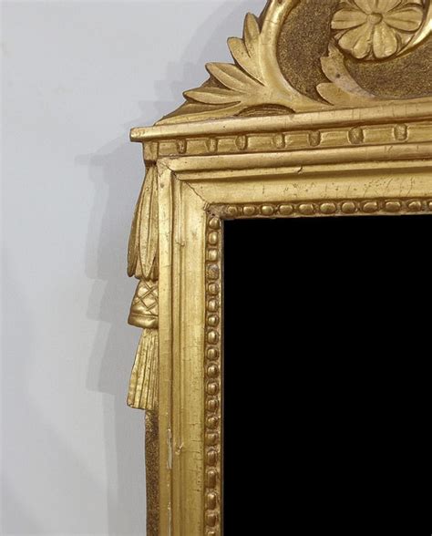 Miroir en bois doré style louis XVI Début XX Antikeo