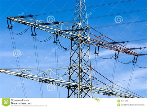 High Voltage Electricity Pylons Against Blue Sky Stock Photo Image Of