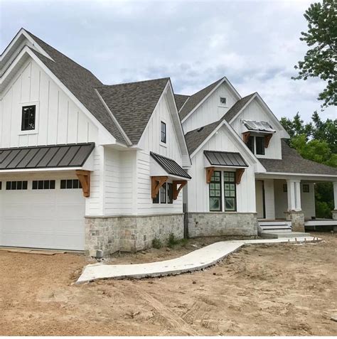 White Farmhouse Exterior With Stone