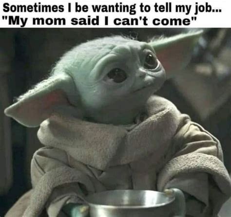 The Baby Yoda Is Sitting In Front Of A Metal Bowl With Something On It