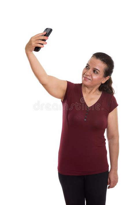 Studio Shot Of Happy Mature Persian Woman Smiling And Standing W Stock