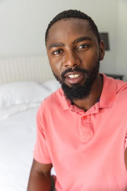 Premium Photo African American Man Relaxing In Bedroom At Home