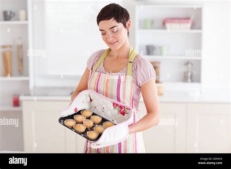 Charming Brunette Woman Showing Muffins Stock Photo Alamy