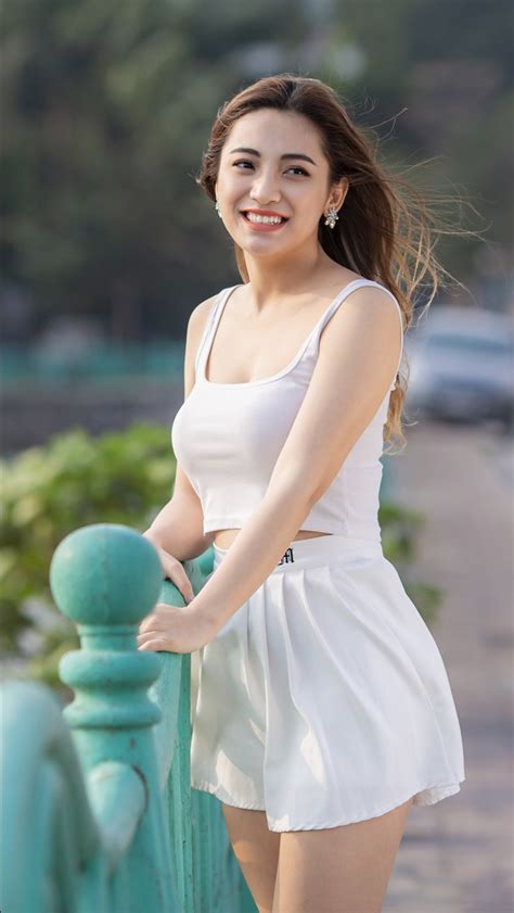 Smiley Girl Model Is Wearing White Dress Standing In Blur Background 4k 5k Hd Girls Wallpapers