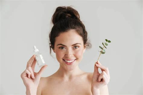 Half Naked Brunette Woman Showing Face Serum Eucalyptus Isolated While