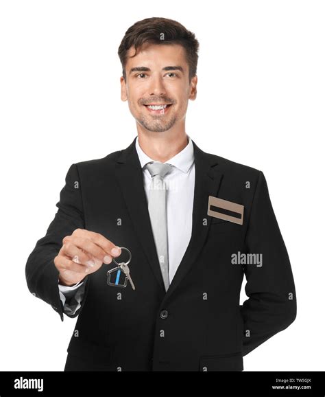 Male Receptionist With Key From Hotel Room On White Background Stock